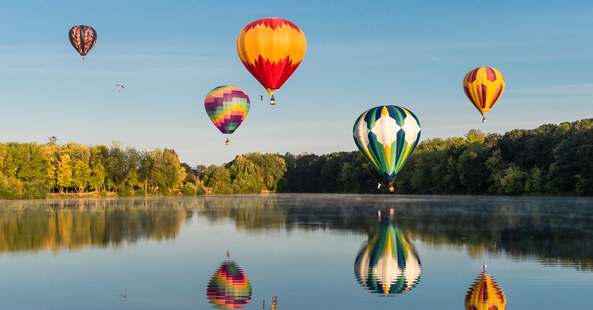 Balloons over water in Albany, Oregon
